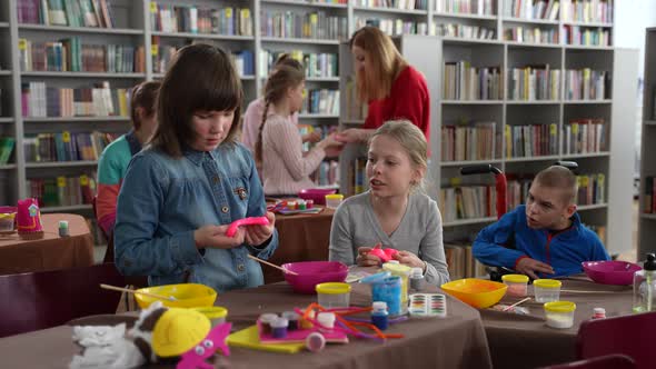 Autistic Girls Playing Slimes During Master Class alt