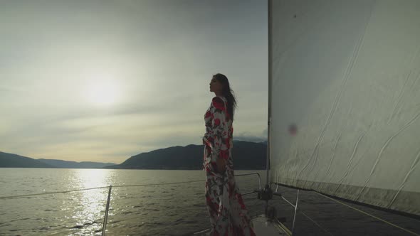 Attractive woman enjoying evening cruise alt