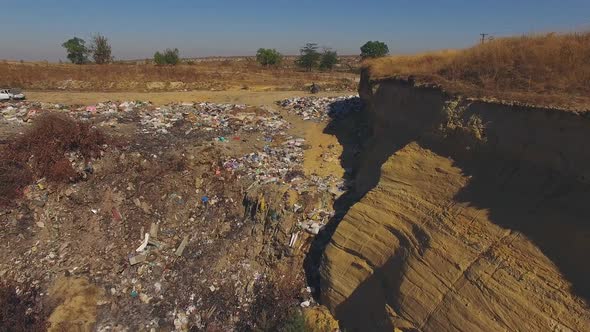Slopes Of Quarry Littered With Garbage