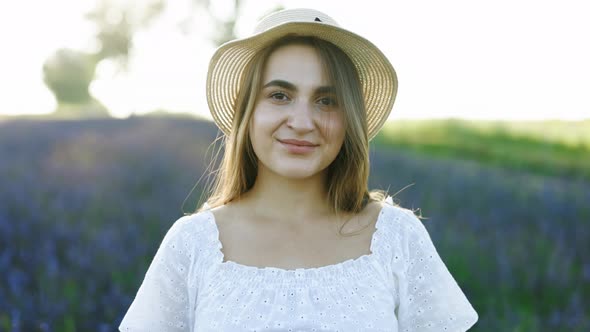 Close Up Portrait of Female Wearing Trendy Hat Smiling at the Camera alt