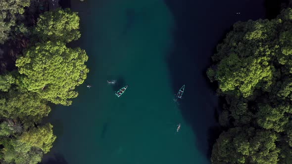 AERIAL: Lago De Camecuaro, Boat, Swimmer, Tangancicuaro, Mexico (Descending Down) alt