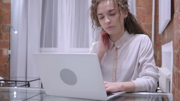 Tired Female Girl Relaxing Muscles While Working on Laptop alt