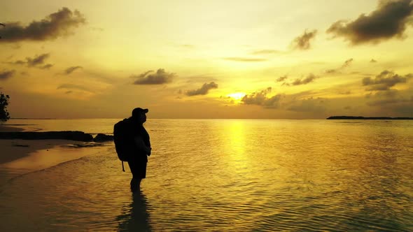 One woman loves life on paradise shore beach vacation by blue ocean and white sandy background of th alt