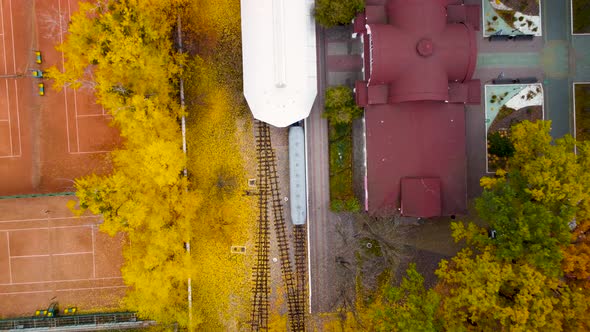 Aerial railway station in yellow autumn forest