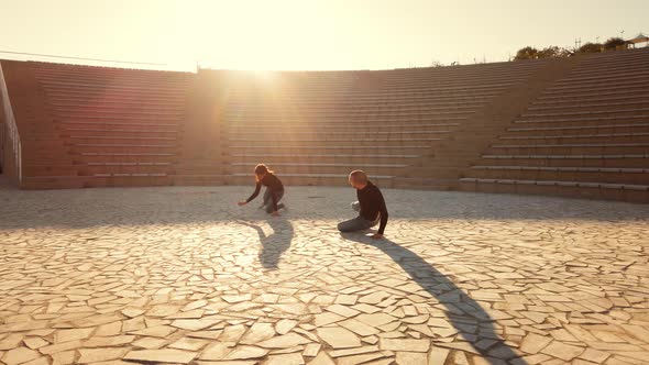 Man and woman couple dancers at outdoor theater alt