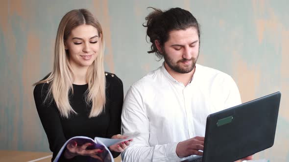 Man and Woman Collegues Working with Papers at Office alt