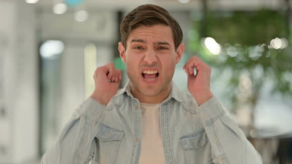 Portrait of Angry Creative Young Man Shouting Screaming alt