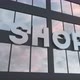 Shop Sign on a Modern Glass Skyscraper - VideoHive Item for Sale