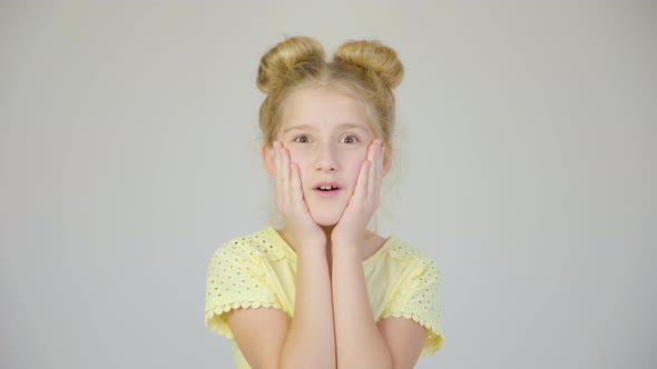 Close Up Portrait of Surprised Little Girl Looking at Camera with Shocked Facial Expression alt