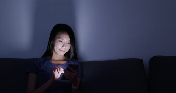 Woman use of smart phone at home alt