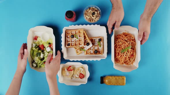 Food Delivery Top View Take Away Meals in Disposable Containers on Blue Background alt
