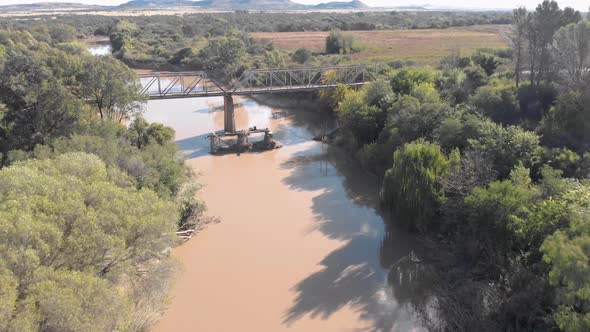 aerial birds eye view flying over a river following the flow of a river alt