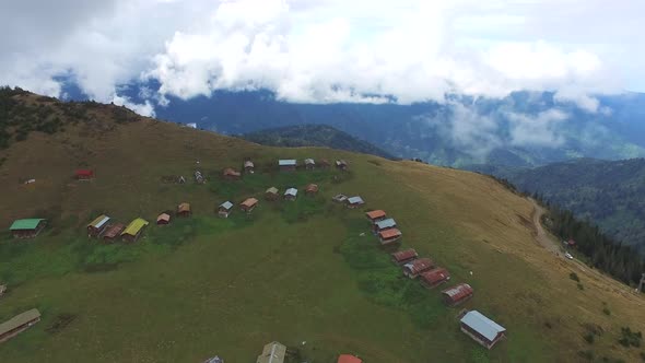 Colorful Little Plateau Houses In The Meadow Above Top Of The Hill alt