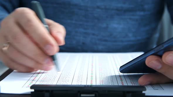 Businessman Using Mobile Phone With Statistic On Screen. alt