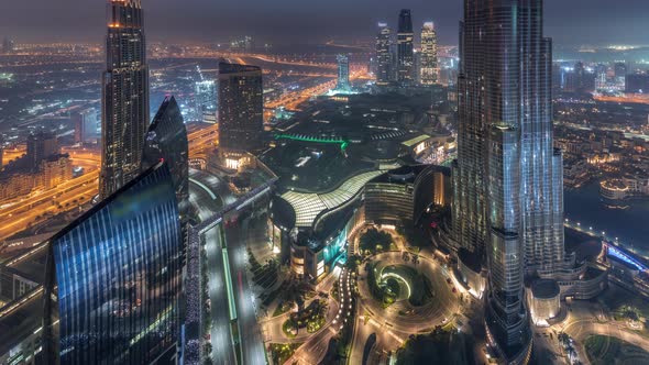 Paniramic Skyline View of Dubai Downtown with Mall Fountains and Burj Khalifa Aerial Night to Day alt