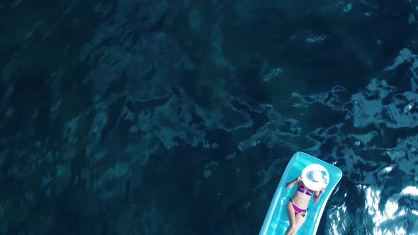 Woman Lying On Air Mattress alt