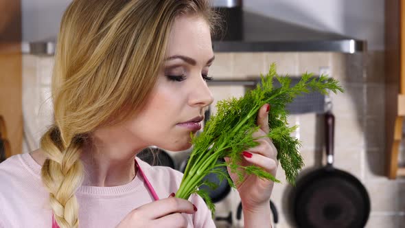 Woman Smelling Green Dill 