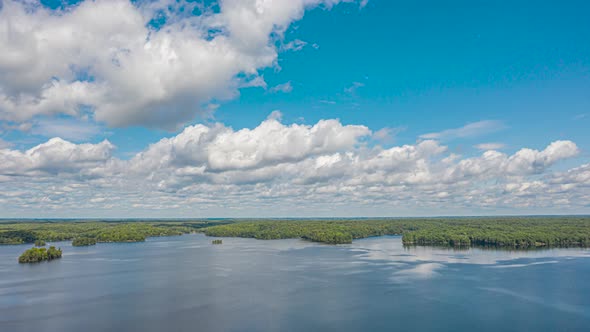 Aerial Time Lapse Of Beautiful Summer Lake And Islands With Clouds Moving Fast 01