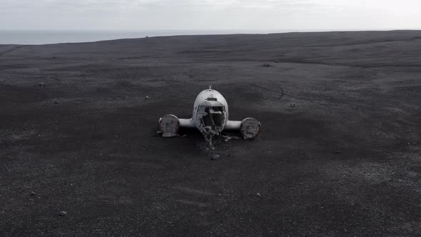 Aerial of an Abandoned Crashed Plane Wreckage on Solheimasandur Beach Iceland alt