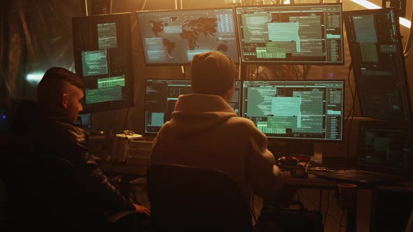 Team of Hackers in Dark Room alt