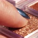 Make-up artist gains metallic glitter from refill with fingertip. Woman working with eyeshadows pale - VideoHive Item for Sale