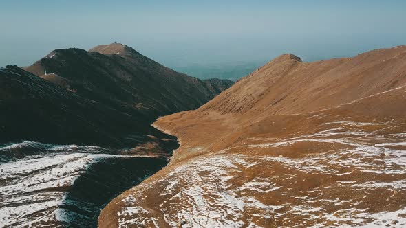 Autumn Mountains Covered with Snow in Places alt