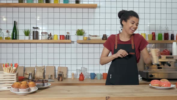 Happy Barista Woman in The Coffee Shop