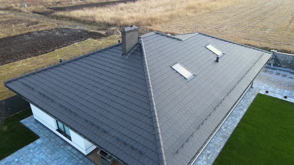 Aerial View of Private House with Ceramic Shingles Covered Roof Top alt