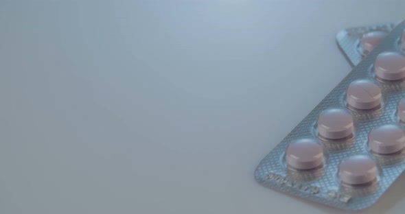 Prescription drugs - Capsules, pills, tablets on reflective background alt