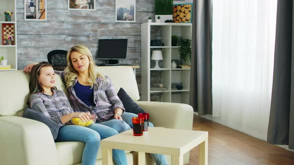 Beautiful Young Mother and Her Daughter alt