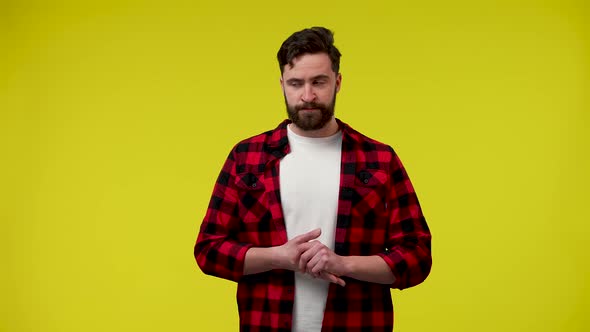 The Man is Nervous Feels Panic and Stress Rubs His Hands in Anxiety and Looks Around alt