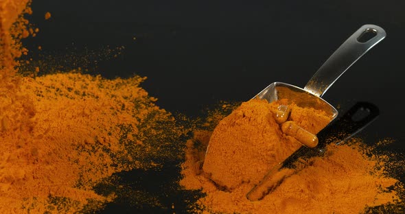 Turmeric, curcuma longa, Powder falling against Black Background, Indian Spice, Slow Motion 4K alt