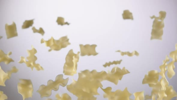 Italian Pasta Mafalde Corte Is Flying Up on a White Background alt