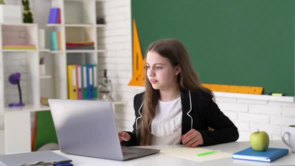 Upset Pupil Study Online with Laptop in Classroom Knowledge