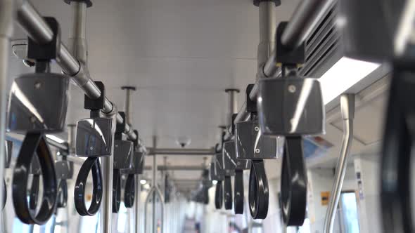 Empty Handrails in a Metro Subway Train  Handle Hand Straps in Public Transportation for Safety alt