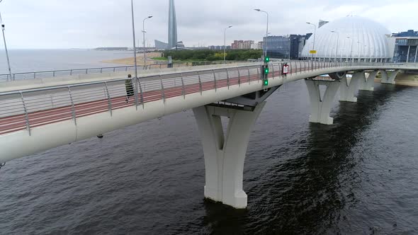 Aerial View. Man Jogging on the Bridge in City, Male Athlete Bridge In The City alt