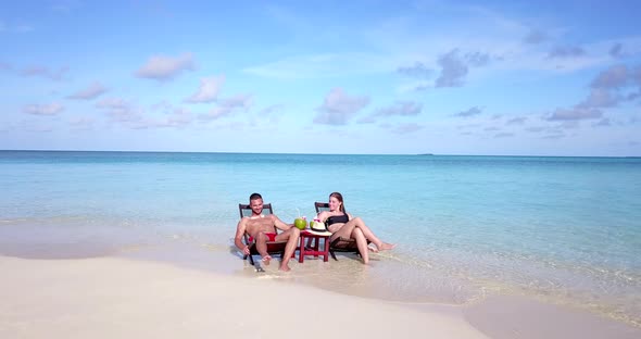 Young boy and girl married on vacation enjoy life on beach on summer white sandy background 4K alt