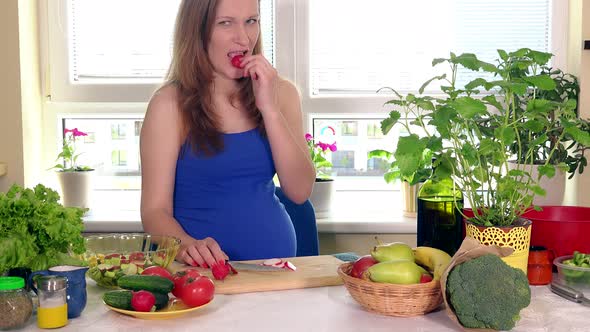Pregnant Woman Cutting Radish Vegetables on Cutting Board
