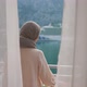 Arab Young Muslim Woman in Hijab Opening Curtain Lace Enjoying Drinking Hot Coffee or Tea Watching - VideoHive Item for Sale
