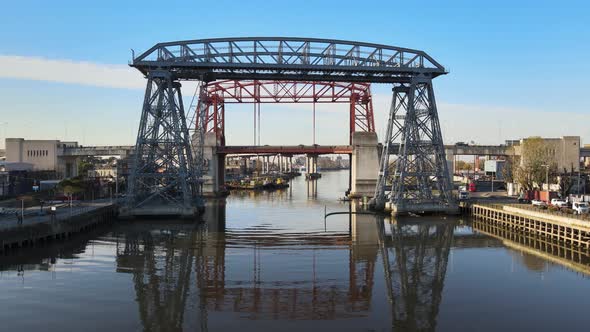 Historic Buenos Aires Transporter Bridge; aerial pan over Riachuelo alt