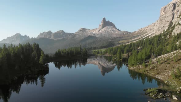 Aerial Flying over Mountain Lake Federa in Dolomites Alps Italy alt