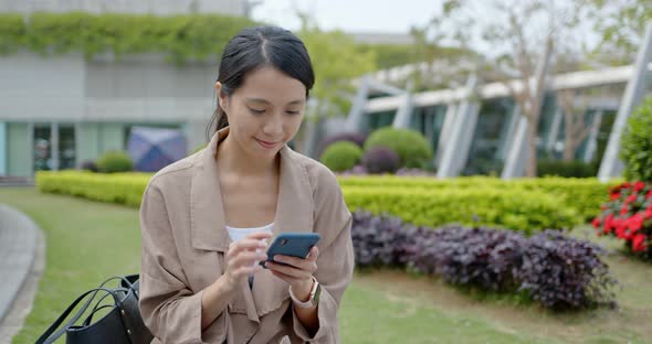 Woman use of mobile phone online alt