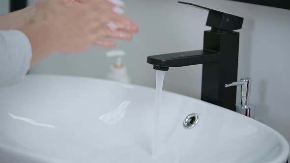 Female Wash Hands with Soft Soap