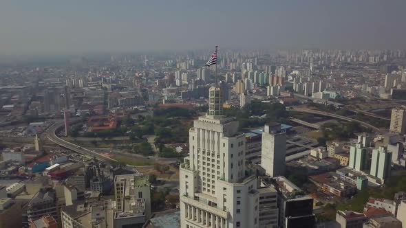 Drone Tall Downtown Banespa Office Buildings On Sunny Day With Sao Paulo Flag 4k