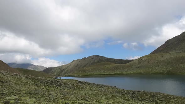 Time lapse lake scene in mountains, national park of Dombay, Caucasus, Russia