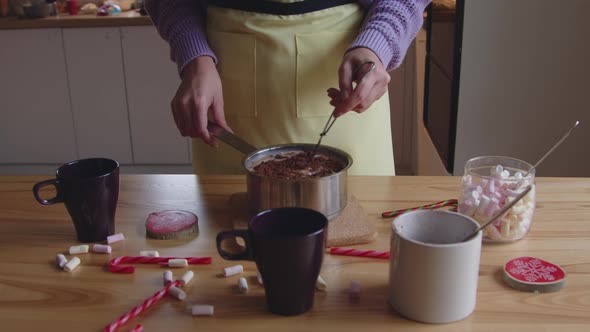 Woman Is Mixing Chocolate Powder with Milk