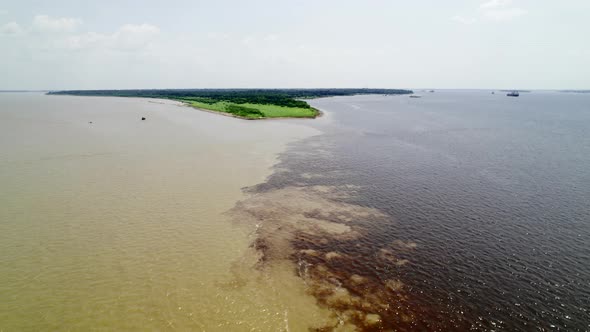 The Confluence of Two Dark and Light Waters of the Encontro Das Aguas and Rio Negro Straits alt