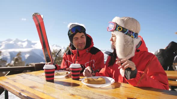 Man and Woman in Restaurant for Lunch on Top of a Mountain