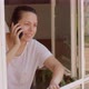 Brunette Woman Speak on the Phone and Look Out of the Window - VideoHive Item for Sale