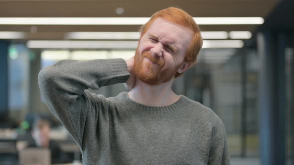 Portrait of Young Man Having Neck Pain alt